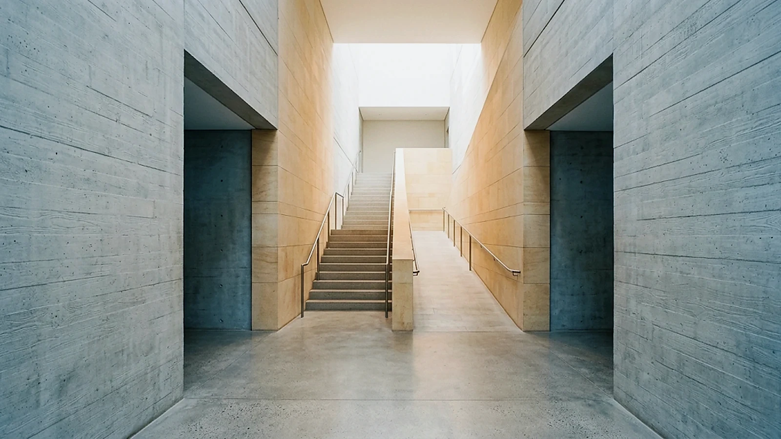 Clear step-free route beside stairs in a contemporary public building